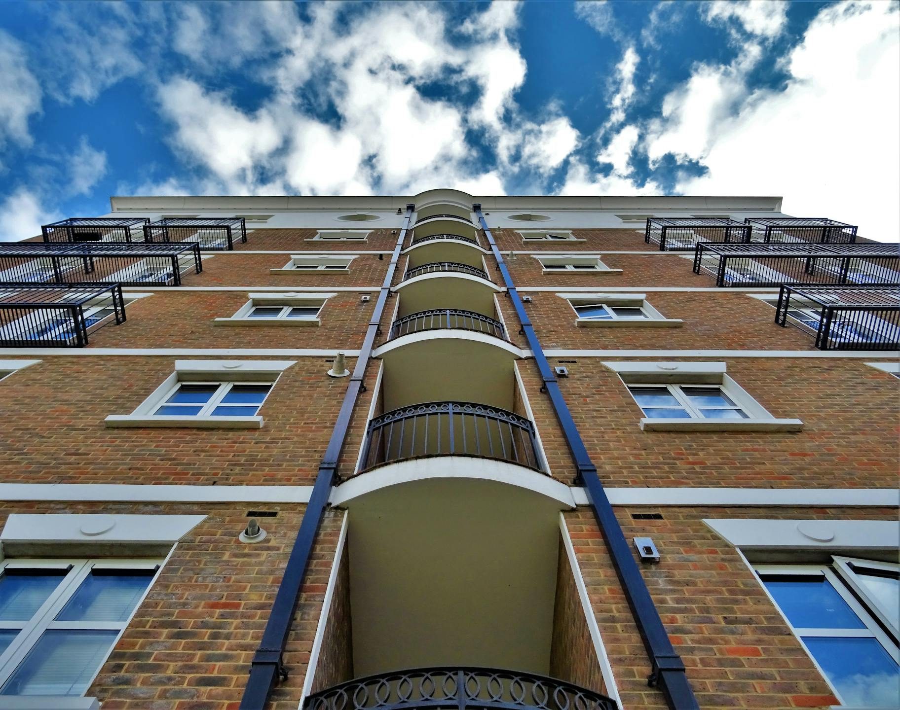 Low Angle Photography of Brown Brick Building